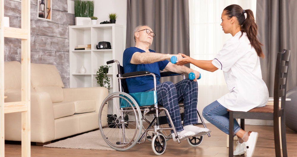 aged-person-suffering-arms-pain-sitting-wheelchair-training-with-dumbbells