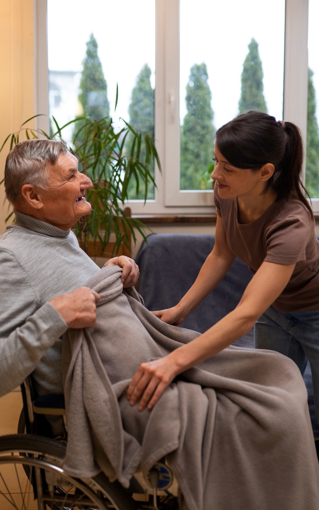 elderly-person-being-taken-care-by-female-caretaker