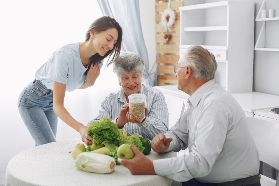old-couple-kitchen-with-young-granddaughter