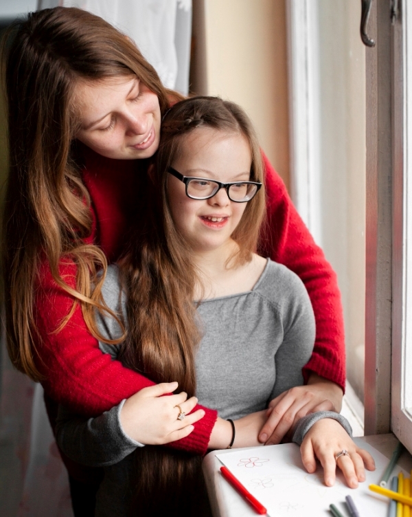woman-girl-with-down-syndrome-posing-by-window