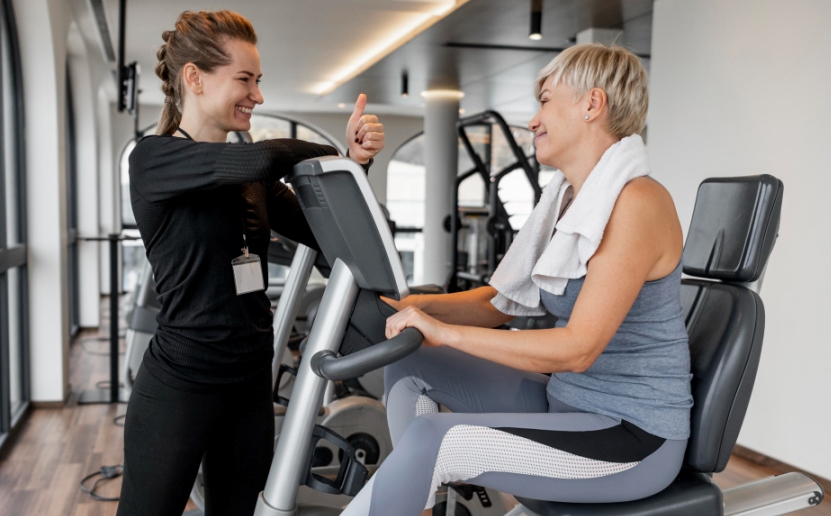 workout-program-trainer-client-using-bicycle