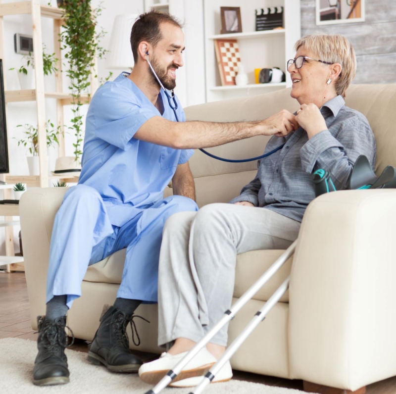 young-doctor-using-stethoscope-listen-old-woman-heart-beat-nursing-home (1)